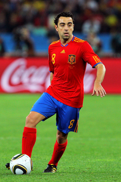 Xavi-playing-for-Spain-xavi-hernandez-16584193-396-594.jpg